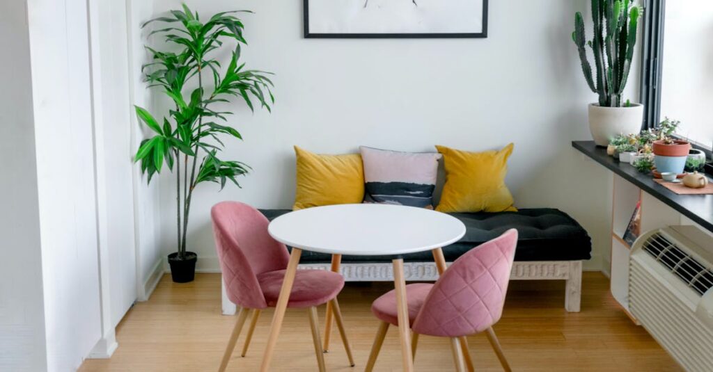 Contemporary living room featuring stylish furniture, artwork, and lush greenery.